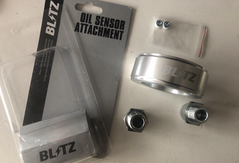 closeup of blitz oil sensor sandwich plate