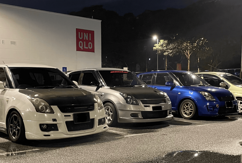 3 Swifts lined up at a parking lot